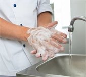 A person washing hands