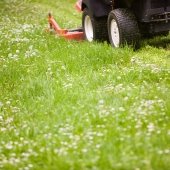 Riding lawn mower on grass