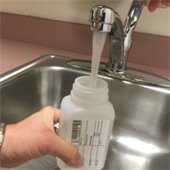 Collecting a water sample from a faucet