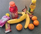 Share table with unopened snacks and fruits with peels