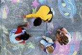 Children doing sidewalk chalk