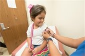 Child receiving an immunization