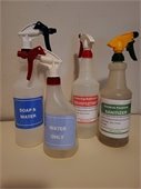 Bottles of bleach sanitizer on a counter
