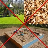 Sandbox, playground, and wood chips with red "X" over them.