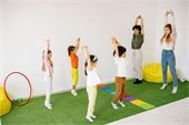 Children and teachers stretching