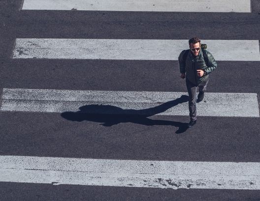 man in crosswalk